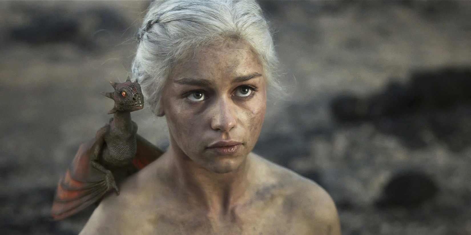 Daenerys Targaryen (Emilia Clarke) stands with a Hatchling Drogon on her shoulder in HBO's Game of Thrones