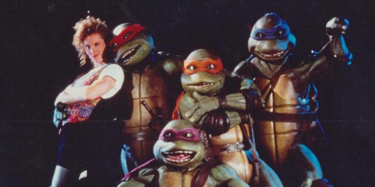 TMNT live from the 1990s posing with April O'Neil.