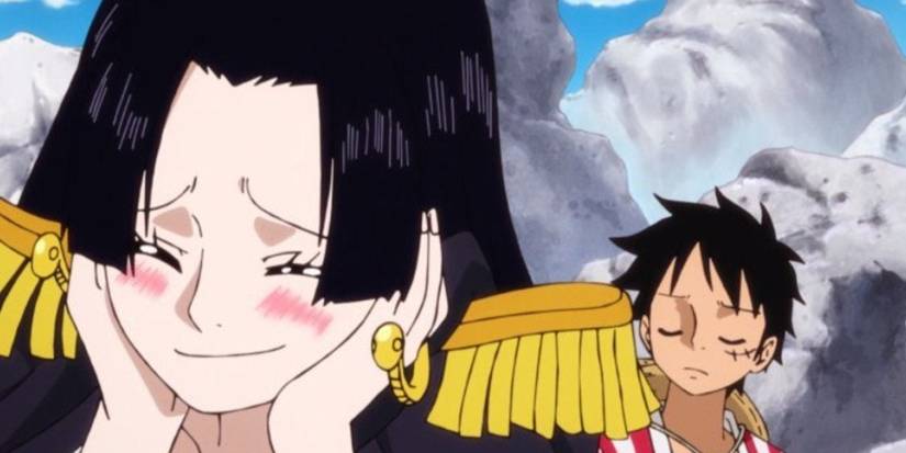Hancock blushes over Luffy while Luffy has his eyes closed.