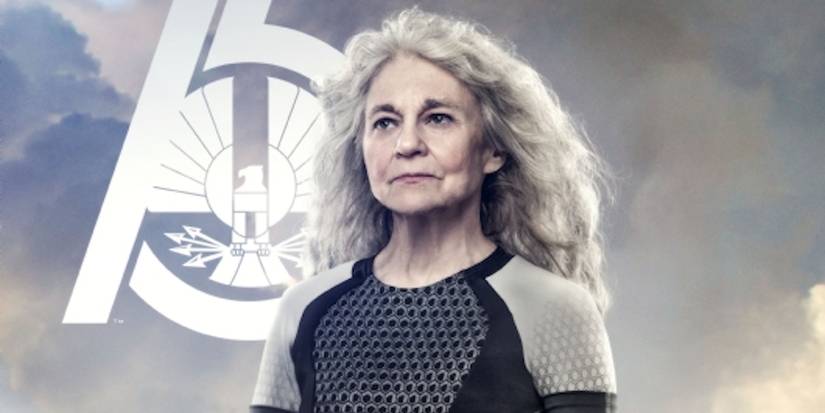 Mags Flanagan standing triumphantly in The Hunger Games.