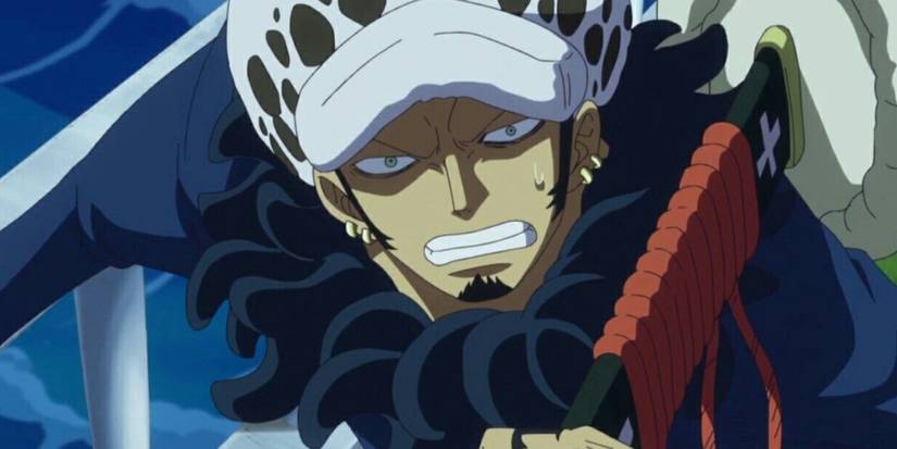 Trafalgar Law serre les dents et dégaine son épée dans One Piece
