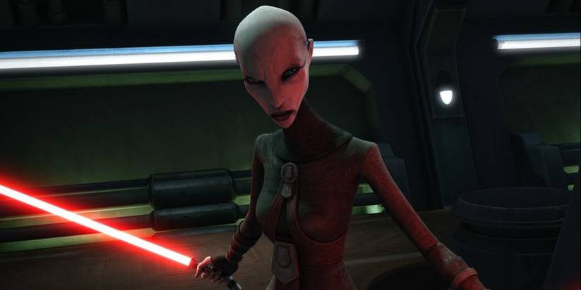 Assaj Ventress wields a red lightsaber and frowns in The Clone Wars.