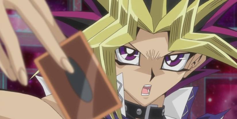 Yami Yugi dramatically draws a card in Yu-Gi-Oh!.