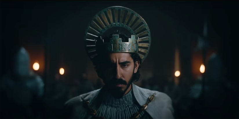 Dev Patel wearing a crown in The Green Knight