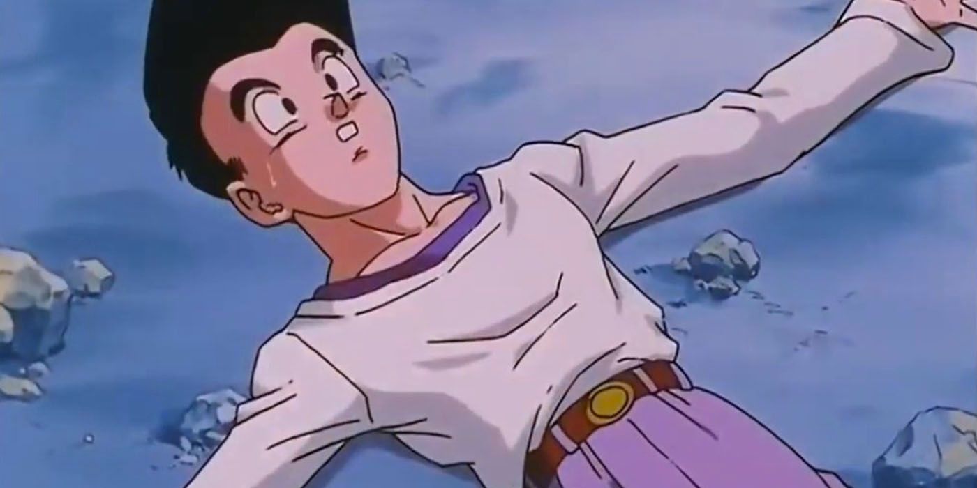 O adolescente Goten está deitado no chão em Dragon Ball GT.