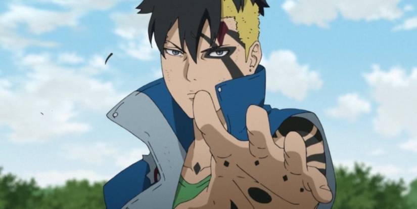 Kawaki holding his hand out against a blue sky in Boruto