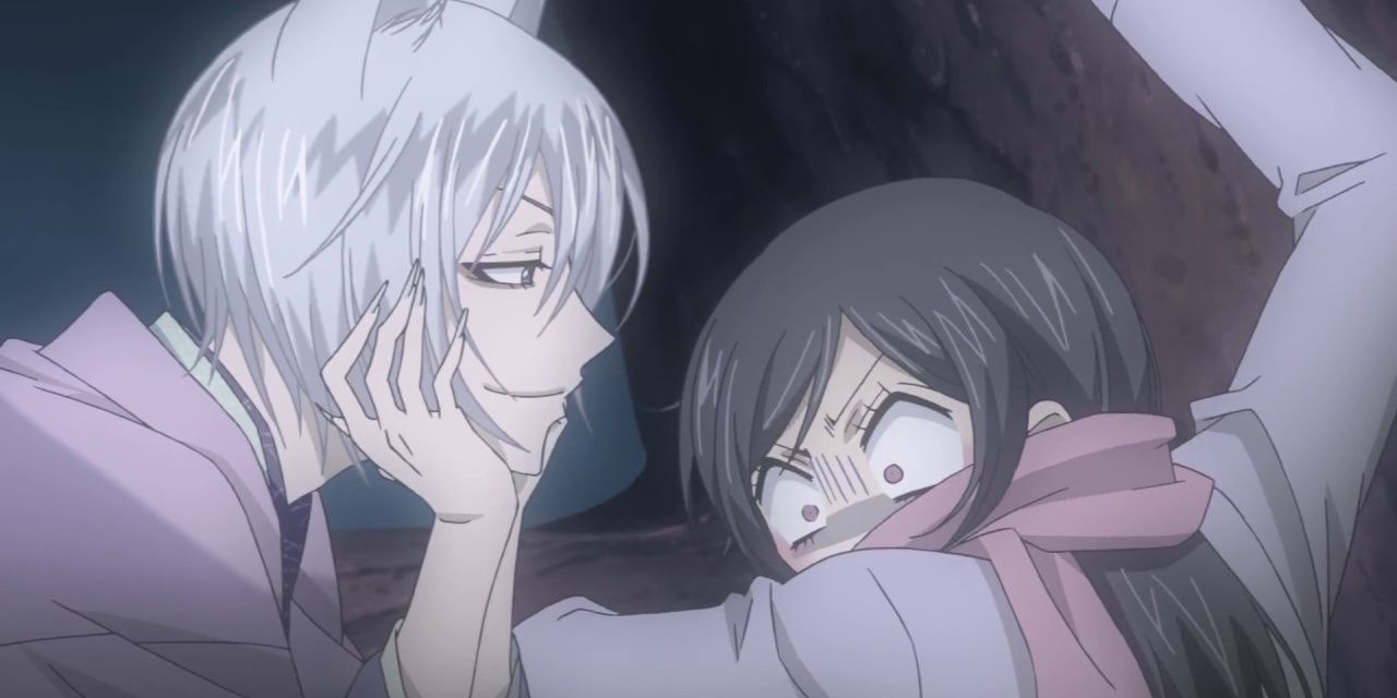 A terrified Nanami hugs a while Tomoe rests his head in his hands from Kamisama Kiss