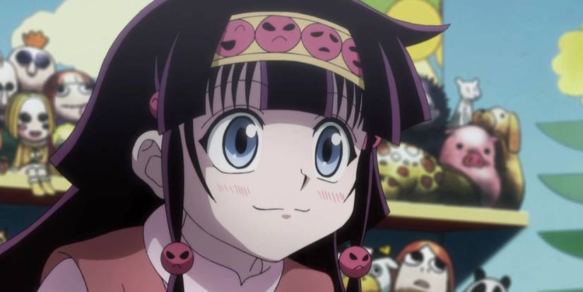 Alluka Zoldyck smiling in front of a shelf of toys in Hunter x Hunter.