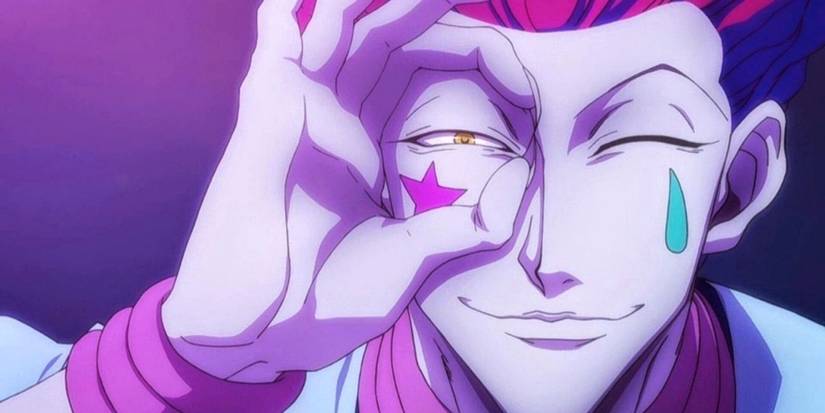 Hisoka Morrow making a circle around his right eye with his fingers in Hunter x Hunter.
