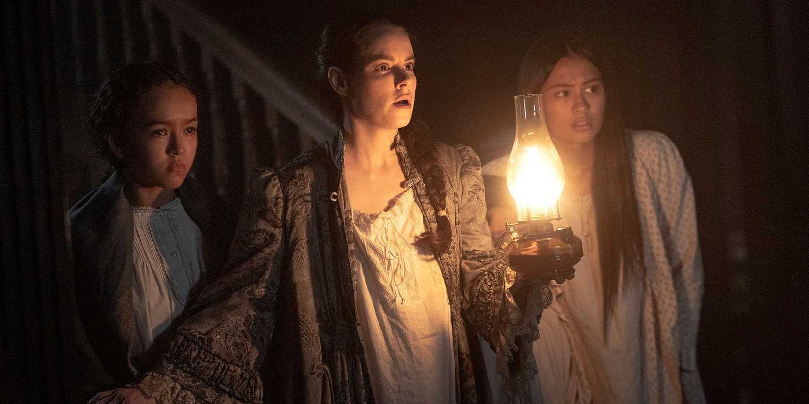 Emily Hampshire from Chapelwaite holds a candle