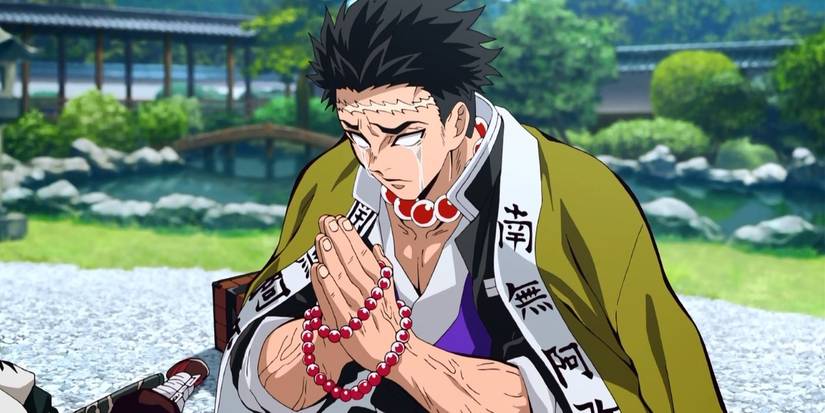 Gyomei Himejima, the Stone Hashira, prays as tears run over his cheeks.