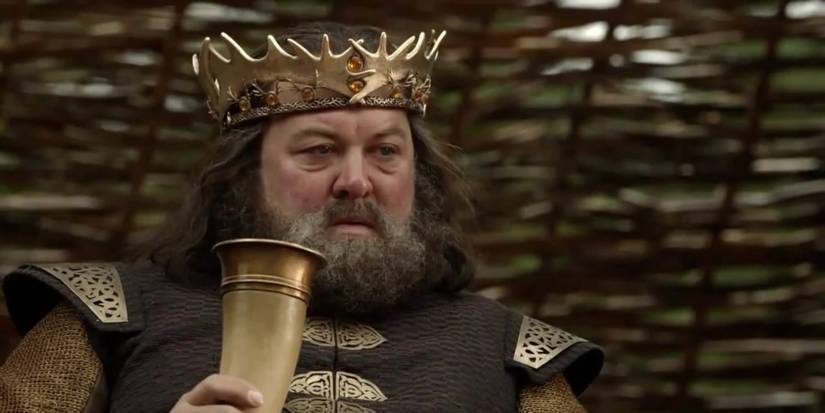 Robert Baratheon drinks and watches a tourney in Game of Thrones