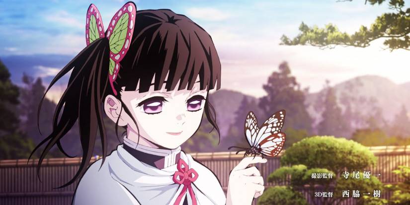 Kanao Tsuyuri looks at a butterfly in the sunrise.