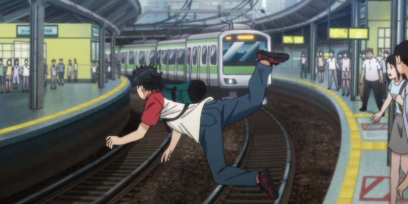 Takemichi is pushed in front of a train