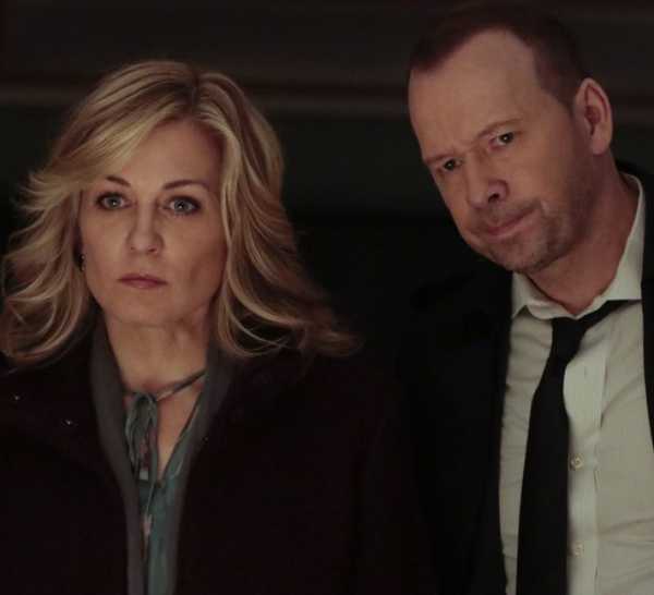 Linda Reagan and Danny Reagan stand side by side and look upset in Blue Bloods.