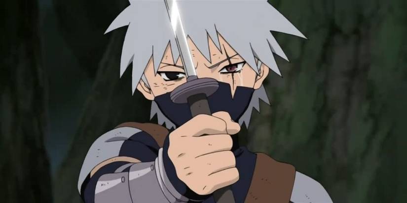 Young Kakashi crying with sharingan in Naruto.