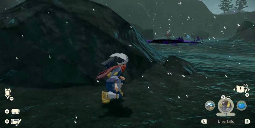 Trainer hiding from Darkrai behind a boulder in Pokémon Legends: Arceus.