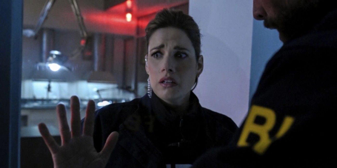 FBI's Maggie Bell (Missy Peregrym) is trapped as her partner OA ZIdan (Zeeko Zaki) looks on.