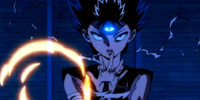 Yu Yu Hakusho's Hiei with a lit third eye as he wipes blood from his mouth.
