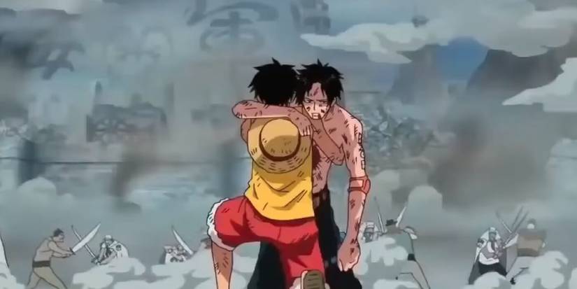Monkey D. Luffy est agenouillé tout en soutenant le corps de Portgas D. Ace alors que le frère aîné meurt dans l'arc Marineford de One Piece.