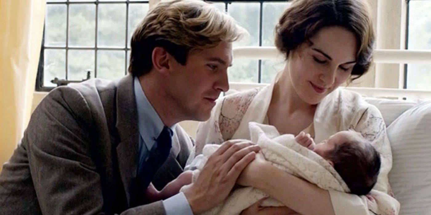 Downton Abbey's Matthew Crawley (played by Dan Stevens) sits with his wife Lady Mary (Michelle Dockery) and their newborn.