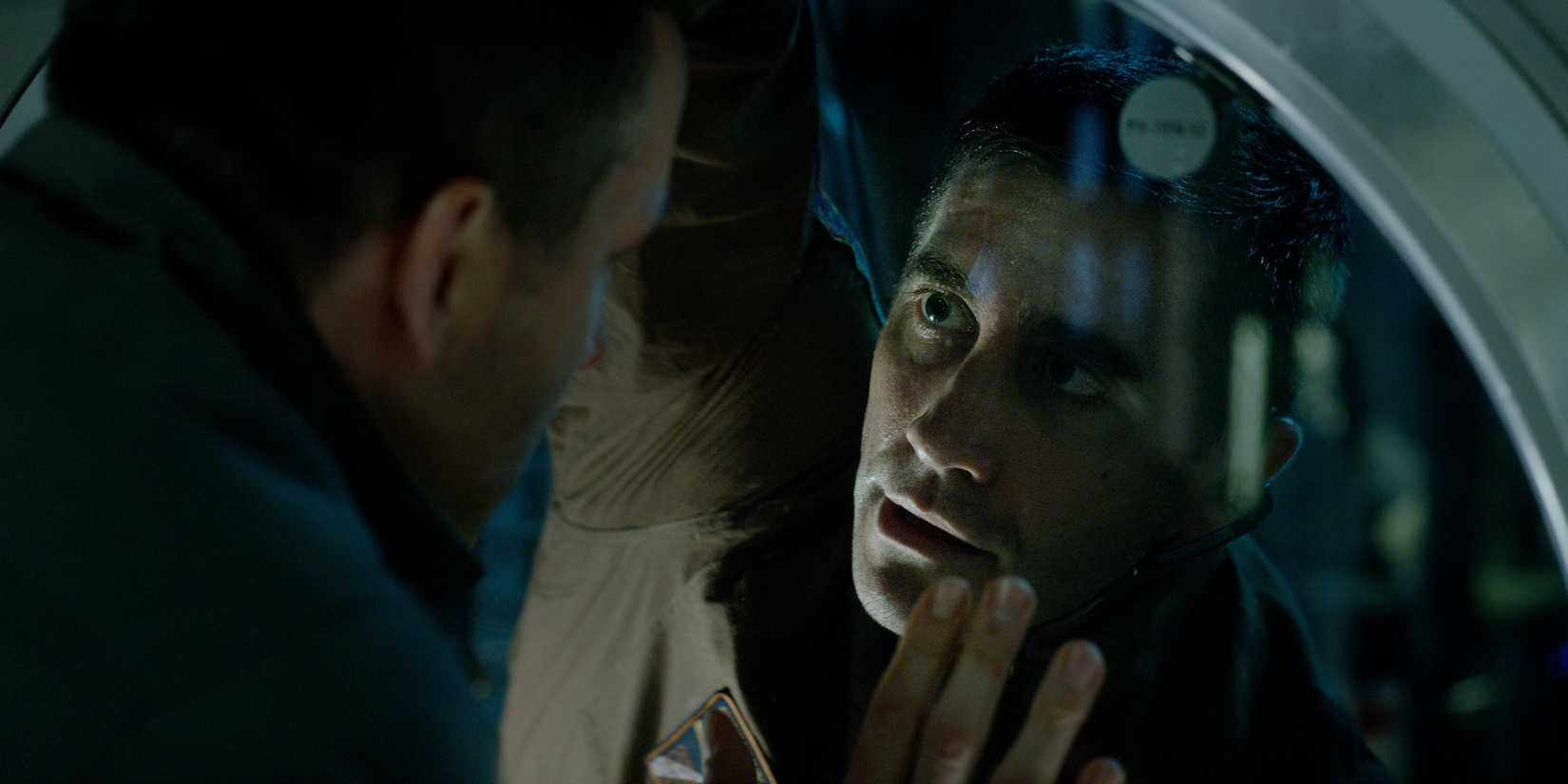 David and Rory arguing against the window in the ship