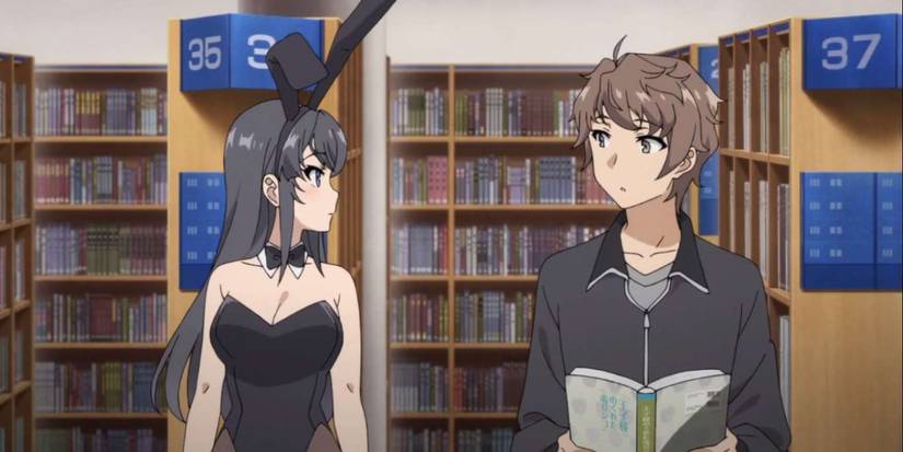 Mai wears a bunny costume as Sakuta eyes her curiously in Rascal Does Not Dream of Bunny Girl Senpai.