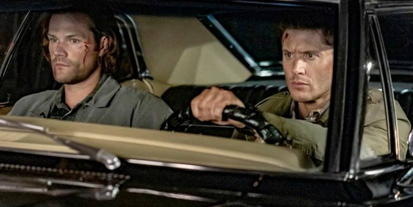 Sam (Jared Padalecki) of Supernatural and Dean Winchester (Jensen Ackles) are seated in the impala with bloody faces.