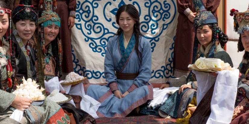 Mongolians sitting in a ceremonial setting in Netflix's Marco Polo.