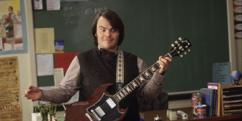 School of Rock: Jack Black holds a guitar