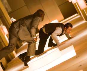 Arthur fighting a projection in the rotating hallway in Inception