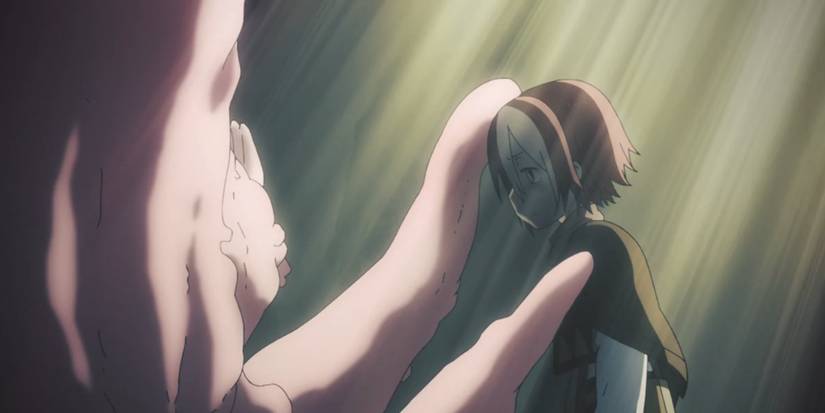 Vueko is consoled by a monstrous Irumyuui in Made In Abyss.