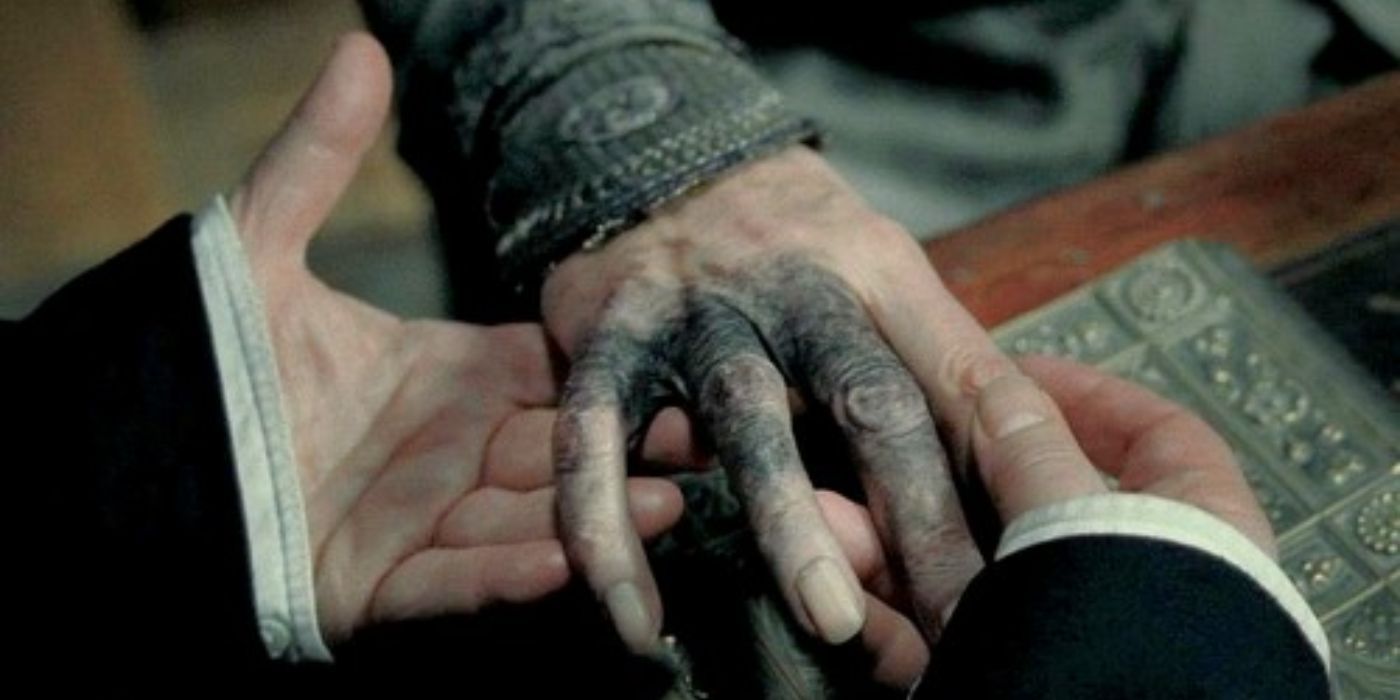 Dumbledore's hand, blackened from the Gaunt ring's curse in Harry Potter.