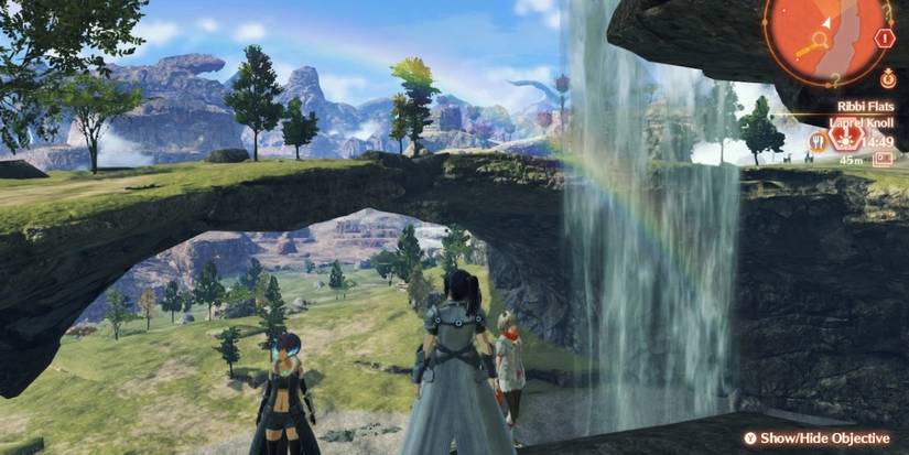 Main characters under a waterfall in xenoblade chronicles 3