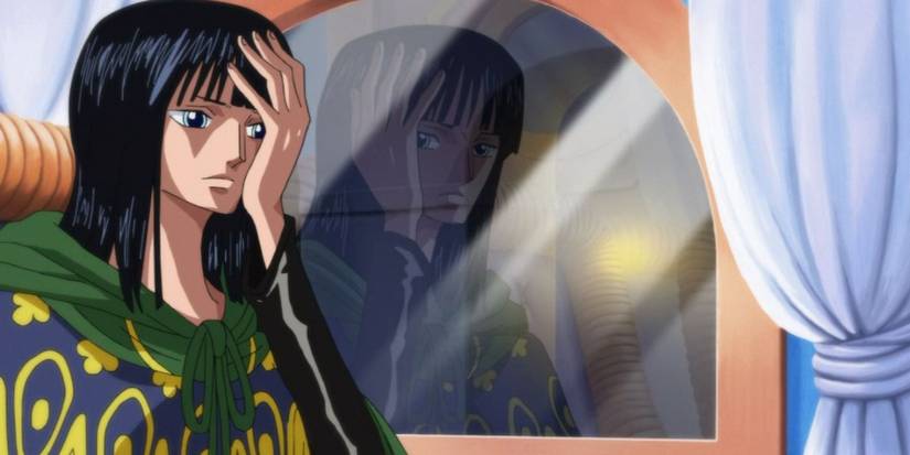 Nico Robin looks troubled as she sits on the train with CP9 in One Piece's Enies Lobby Arc.