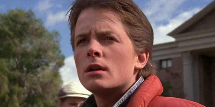 Michael J. Fox is Marty McFly looking confused outside in Back to the Future.