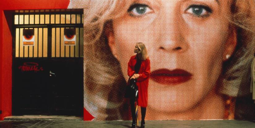 A woman stands by the street in All About My Mother