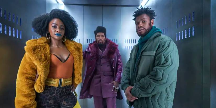 Yo-Yo (Teyonah Parris), Slick Charles (Jamie Foxx) and Fontaine (John Boyega) wait in an elevator in They Cloned Tyrone