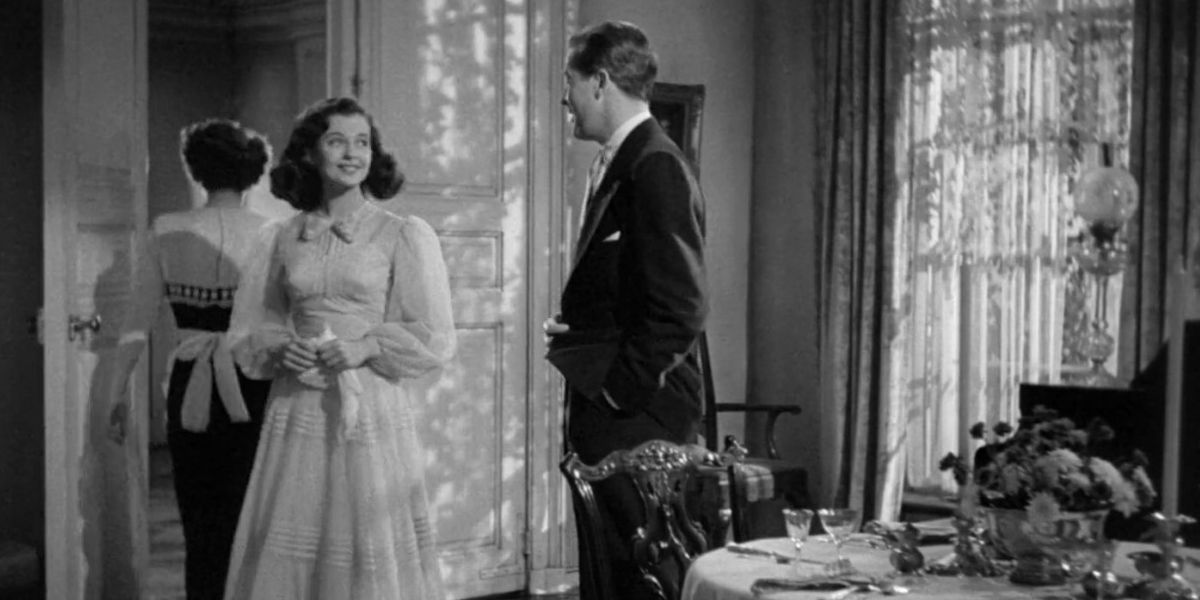 Ruth Hussey, Gail Russell, and Ray Milland in a scene from The Uninvited