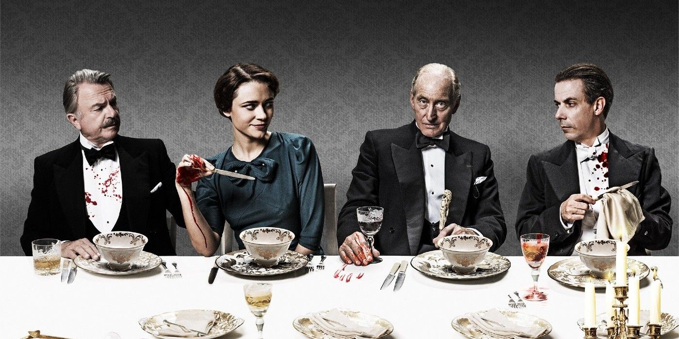 The cast of And Then There Were None sit at a bloody dining room table.