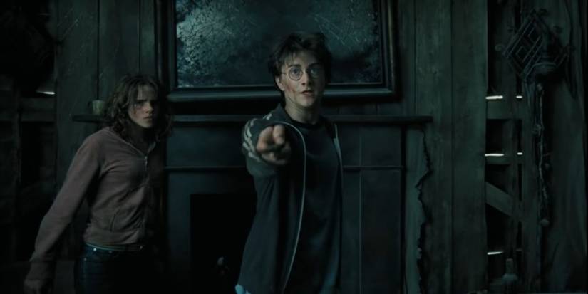 Harry Potter aims a wand at Sirius and Lupin as Hermione looks on.