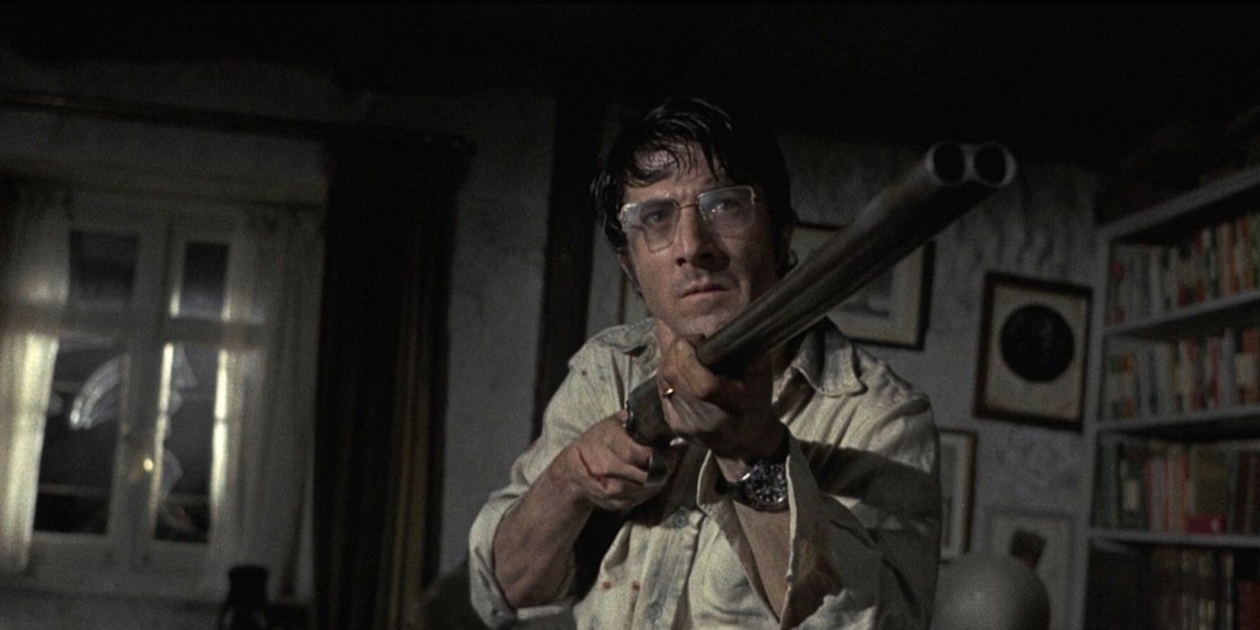 Dustin Hoffman aims a double barrel shotgun at an intruder in Straw Dogs