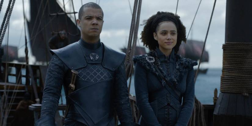 Grey Worm and Missandei standing together on a ship in Game of Thrones.