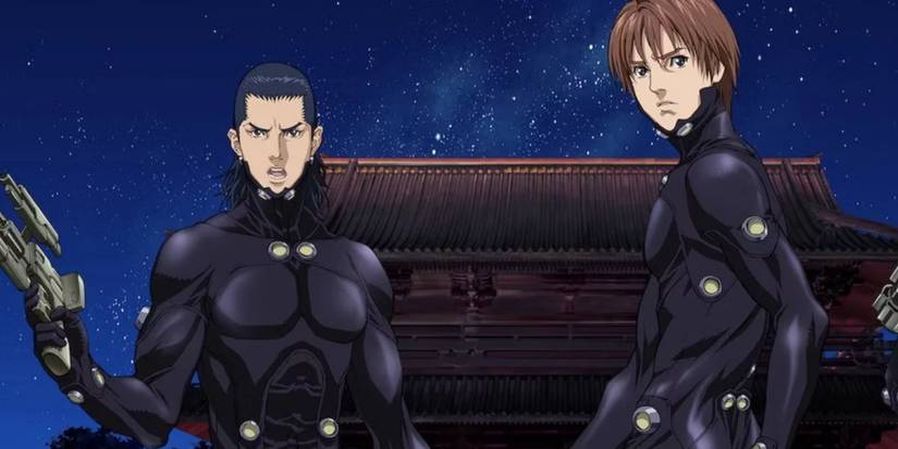 Kei and Kato stand together with the night sky behind them in the anime Gantz.