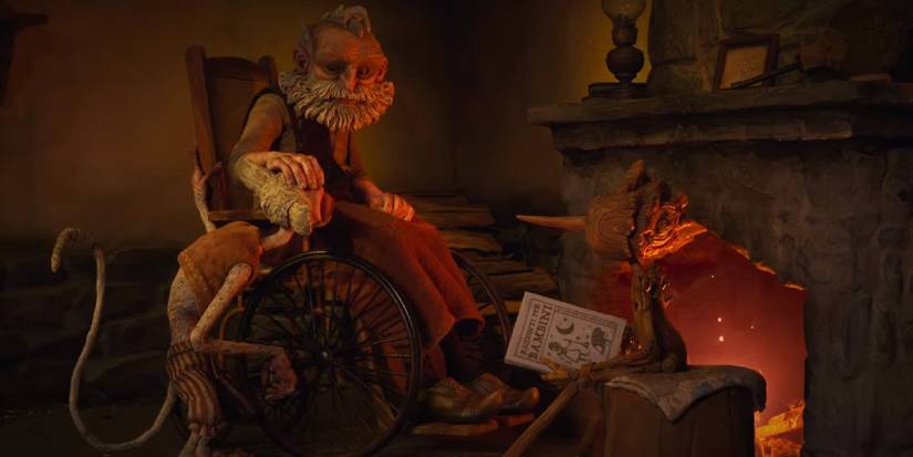 Geppetto, Spazzatura, and Pinocchio sit by the fireplace in Guillermo del Toro's Pinocchio