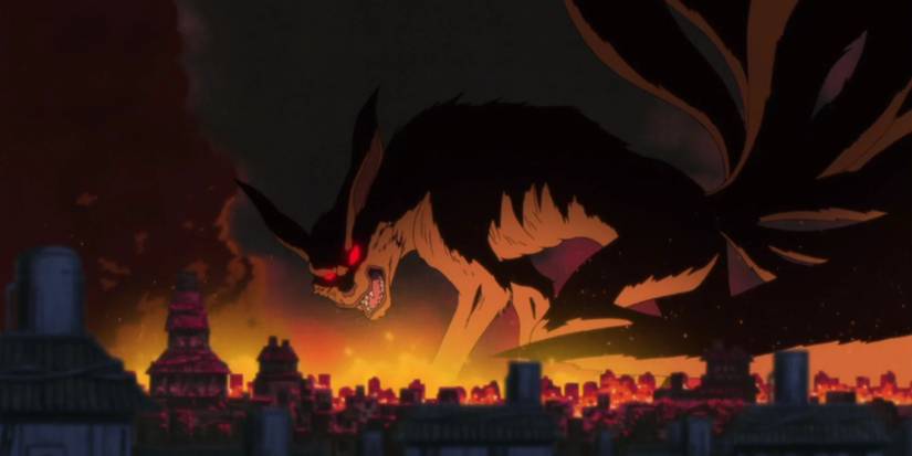 Kurama with glowing red eyes destroys the Hidden Leaf Village in a Naruto flashback.