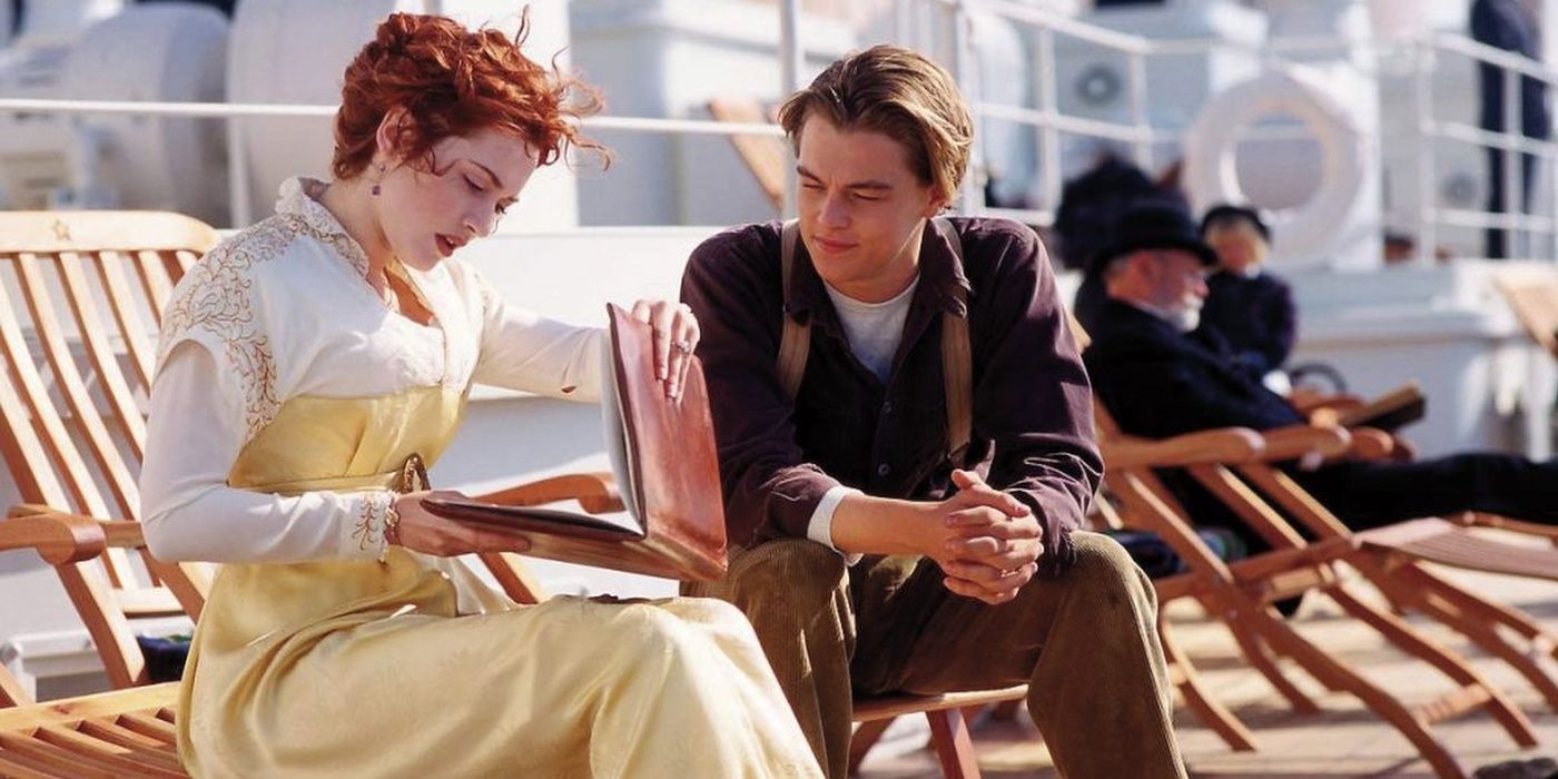 A Titanic scene showing Rose look through Jack's sketchbook