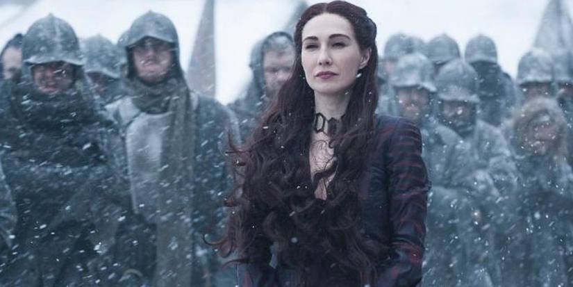 Melisandre with knights behind her in Game of Thrones
