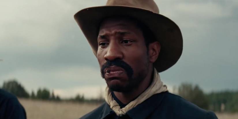 Henry chews a cigar in Hostiles