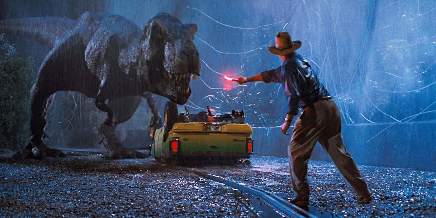 Dr. Grant tenta afastar um T-Rex quando ele aparece na chuva em Jurassic Park.